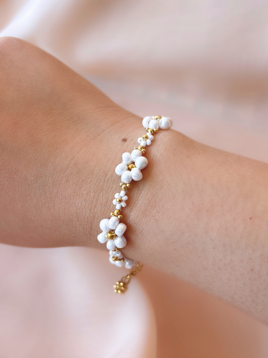 Dear Daisy Bracelet in Cloud Nine, featuring white flower beads made of premium Japanese seed beads, shown worn on a wrist.