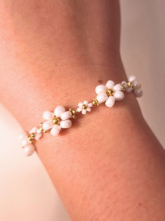 Dear Daisy Bracelet in Cloud Nine, featuring white flower beads made of premium Japanese seed beads, shown worn on a wrist.