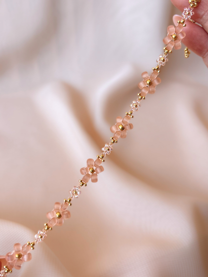 Close up of Dear Daisy Bracelet in First Kiss, showcasing premium Japanese seed bead translucent pink flowers.