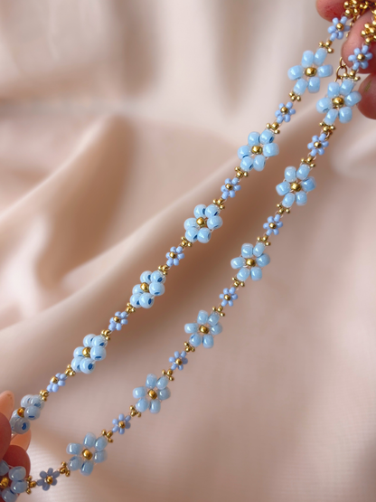 Close up of Dear Daisy Choker in Glass Slipper, showcasing blue flower designs made of premium Japanese seed beads.