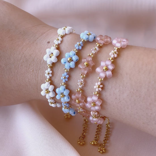 A video showcasing each color of the Dear Daisy flower bracelet collection worn on a wrist, highlighting the premium Japanese seed beads and their unique sparkle.