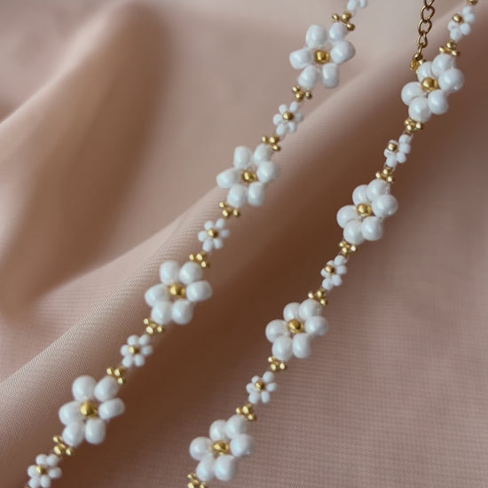 A video showcasing Dear Daisy Chokers in all available colors, highlighting the exquisite detail of premium Japanese seed bead flower designs.