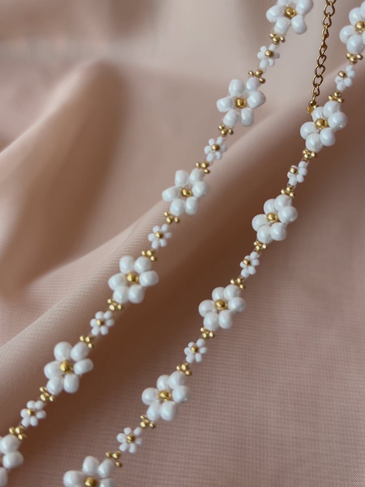 A video showcasing Dear Daisy Chokers in all available colors, highlighting the exquisite detail of premium Japanese seed bead flower designs.