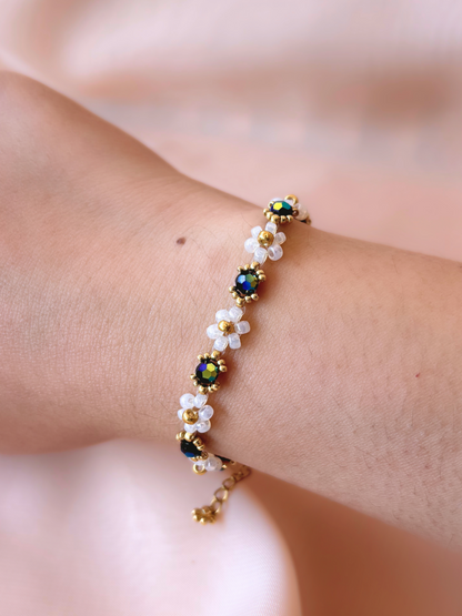 Wildflower Coquette bracelet in Midnight Rain, made of premium Japanese seed bead daisies with black Preciosa crystal AB centers.