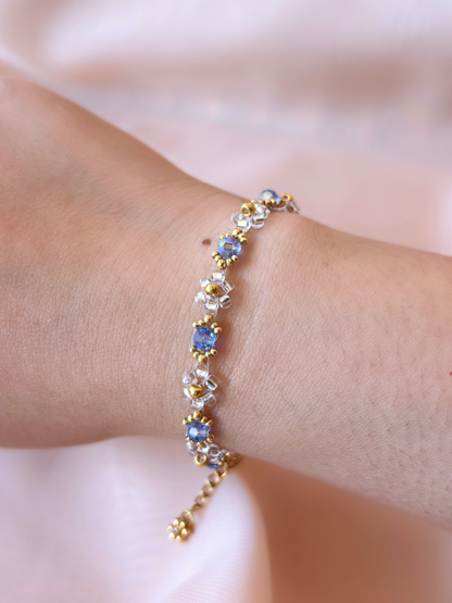 Wildflower Coquette bracelet in Pixie Dust, made of premium Japanese seed bead daisies with blue Preciosa crystal AB centers.