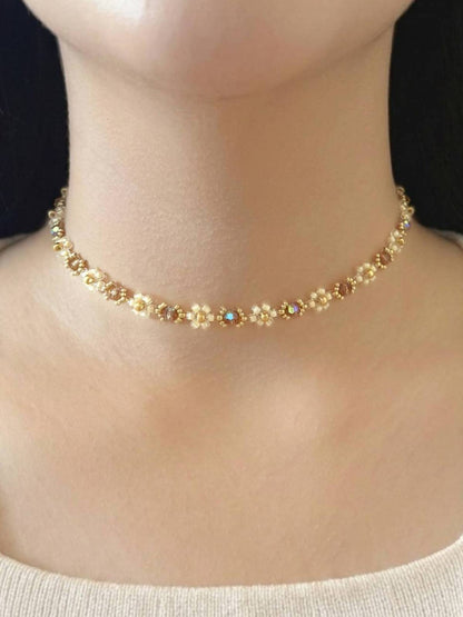 Wildflower Coquette Choker in Gold Rush, made of premium Japanese seed bead daisies with topaz Preciosa crystal centers, shown worn on a model's neck.
